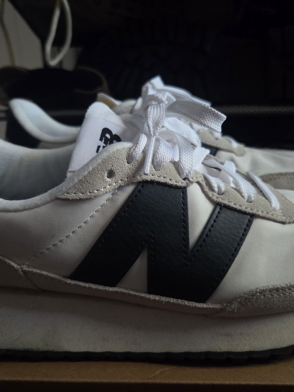 New Balance Women's White Sneakers with Black 'N' Accent